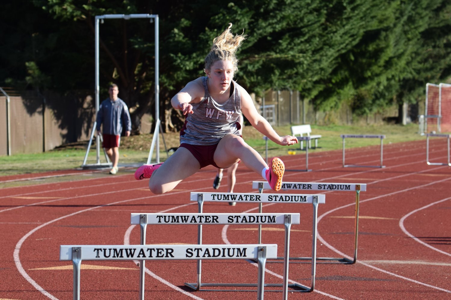 Emily Mallonee runs the 300-meter hurdles at W.F. West's meet at Tumwater on March 21.